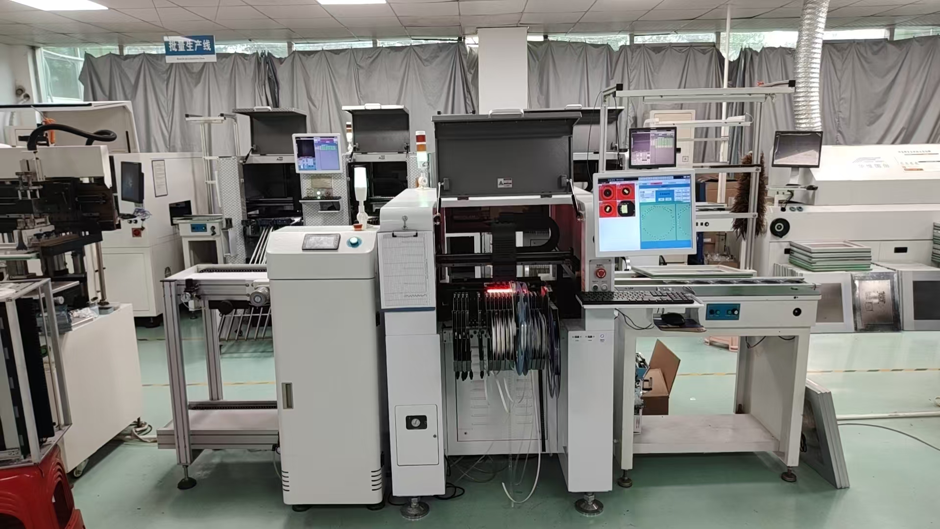 Compact SMT production line with stencil printer, pick and place machine, conveyor and reflow oven for small batch PCB assembly